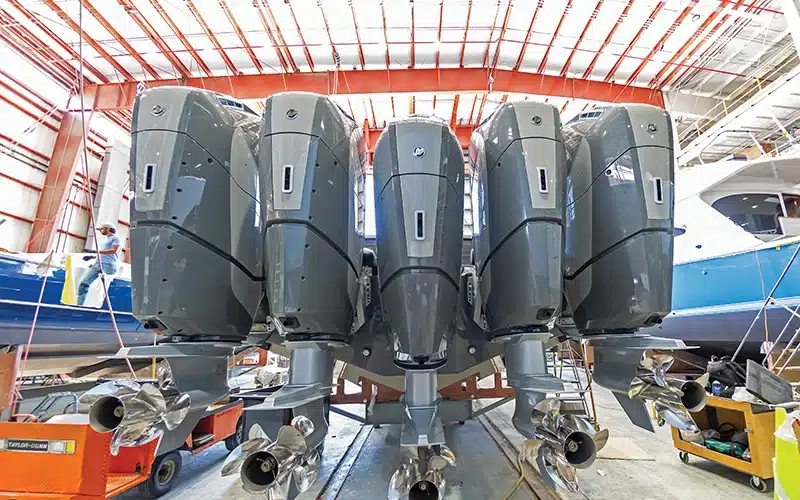 Rear view of a Valhalla Boatworks center console boat with four powerful outboard engines in the assembly line