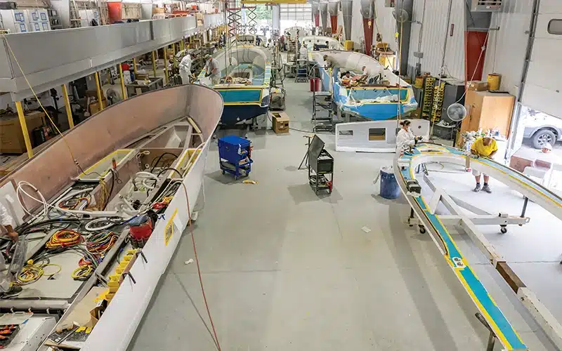 Valhalla Boatworks factory floor with multiple boats in different stages of construction, highlighting the brand's production capabilities