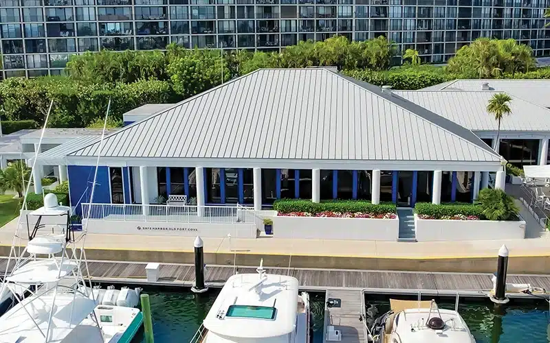 Exterior of Safe Harbor Old Port Cove marina building with yachts docked